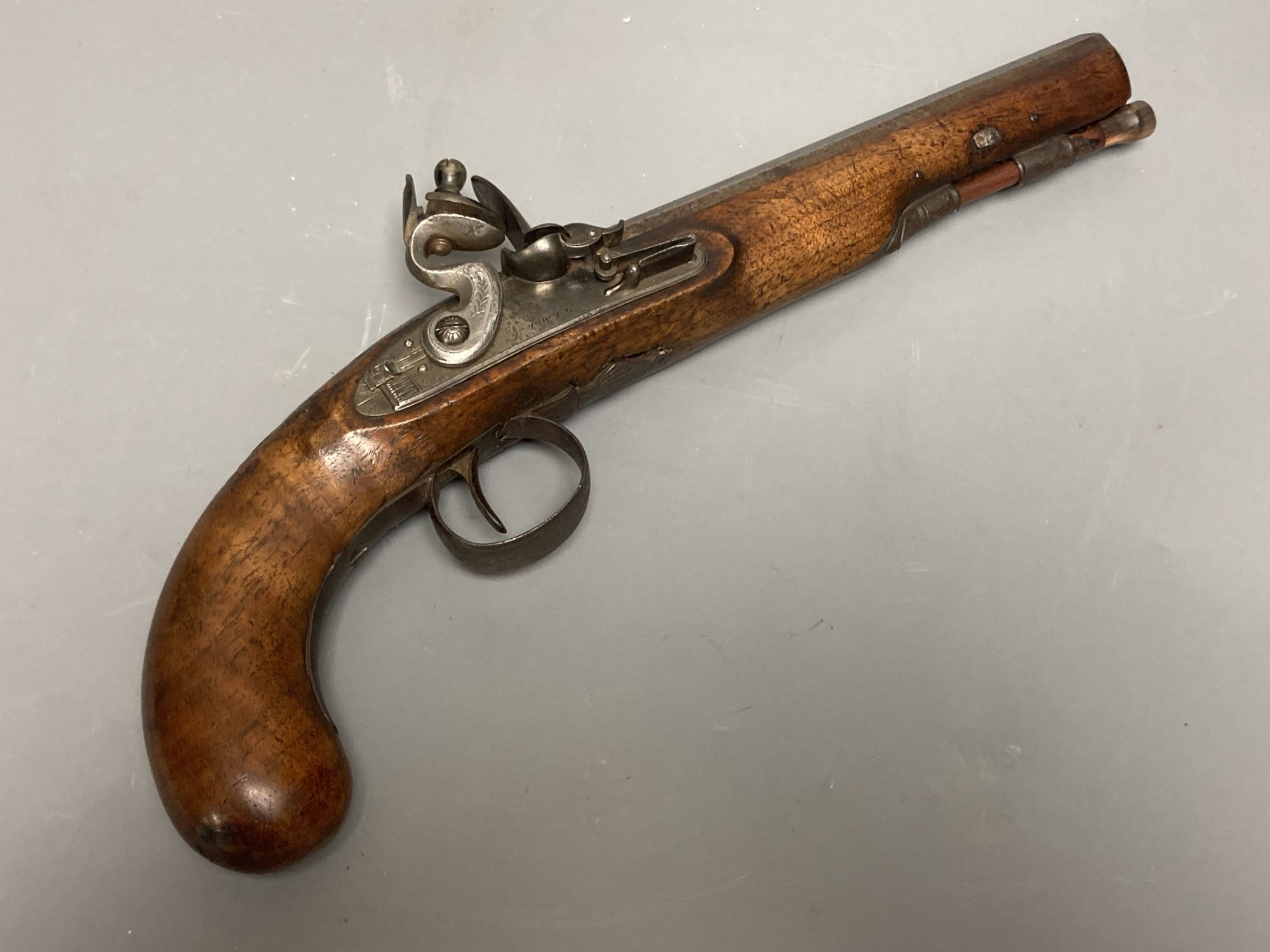 A 19th century octagonal barrelled flintlock pistol, lockplate engraved Twig